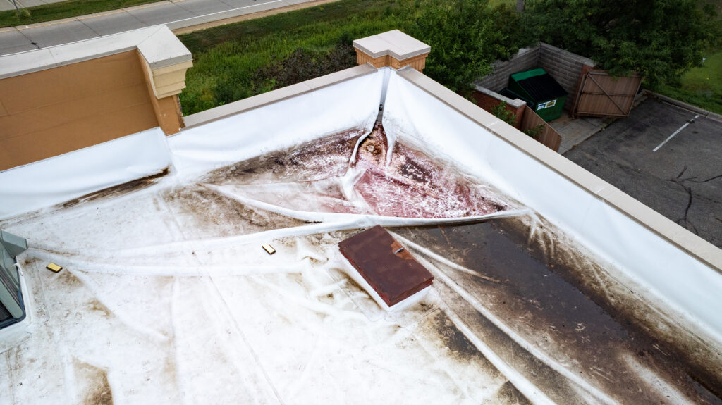 Aerial view of roof membrane shrinkage and staining