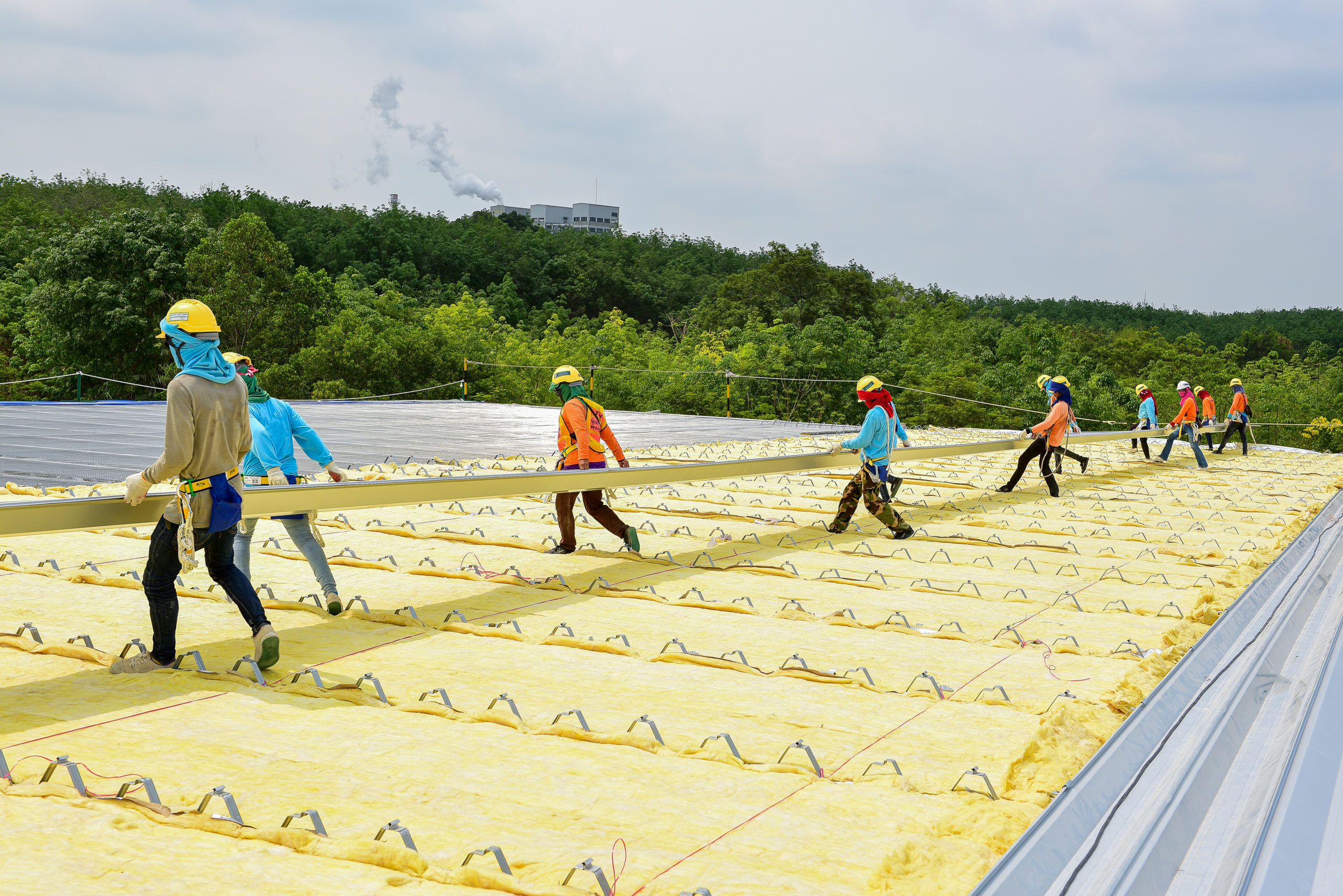 11 construction works installing a new metal roofing sheet