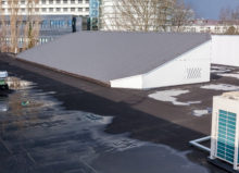 Large commercial roof with water pooling