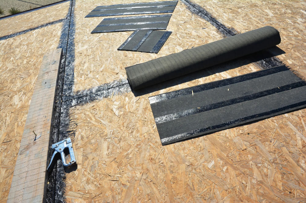 Preparing a roof deck and working tool stapler, having the surface of the roof sheathing clean and smooth before underlayment