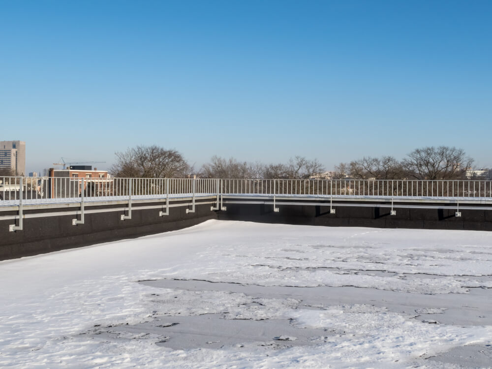 Snow and ice that needs to be removed on flat roof