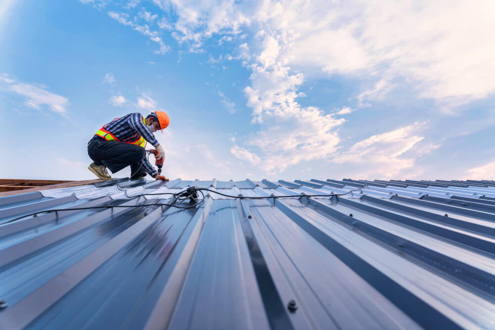 Worker attached a new metal roof