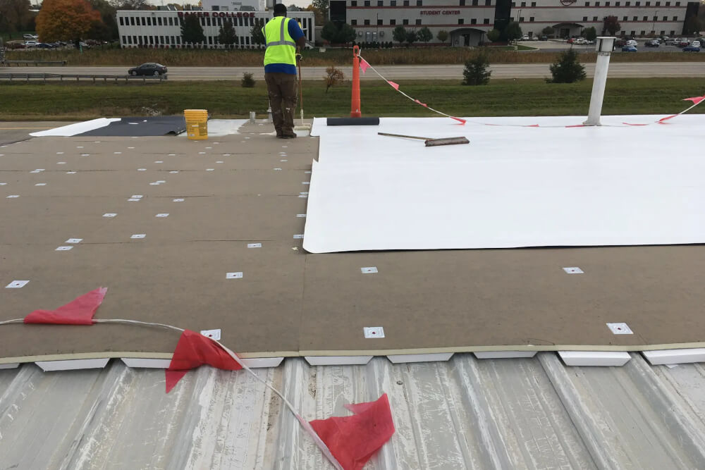 PVC roofing being rolled out